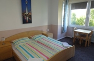 The double rooms have washing facilities in the room, a small seating area, TV with local channels and a desk. One of our double rooms also has its own balcony.